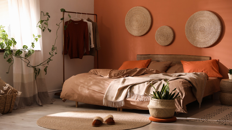 orange bedroom with plants