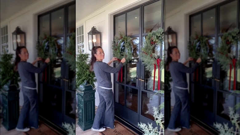 Joanna Gaines fixing ribbons on wreaths