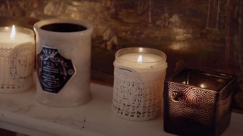 Diptyque candles on shelf