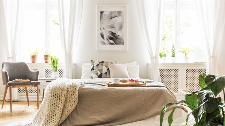 white sheer curtains around bed