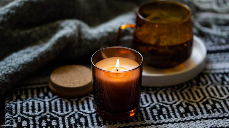 candles on a textured mat