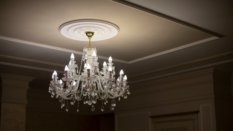 lit chandelier in dark room