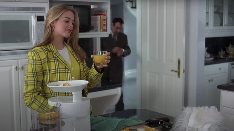 Cher holds orange juice