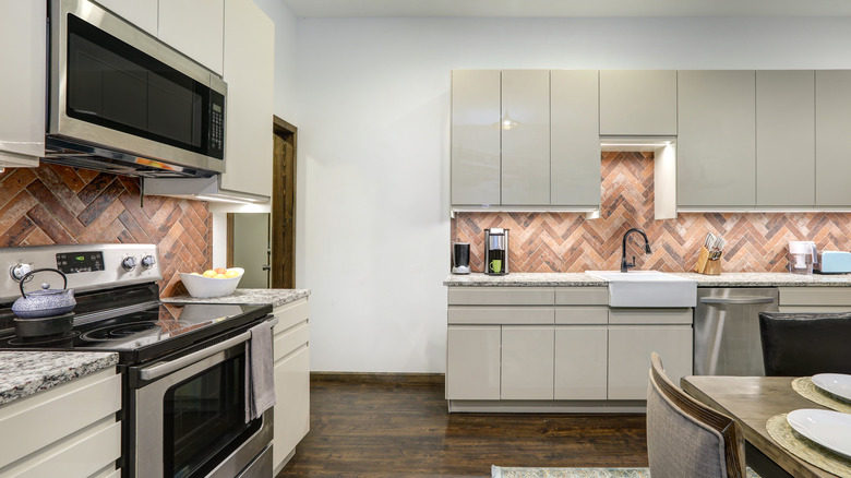 kitchen with rustic brick backsplash