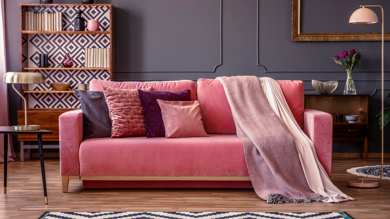 pink couch with layered blankets