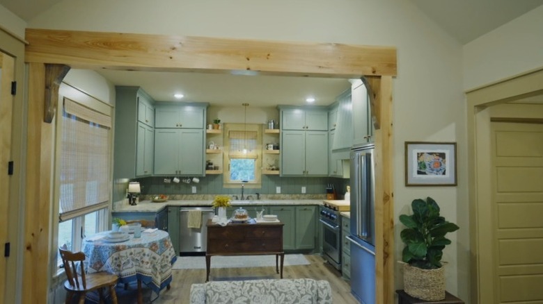 A kitchen with exposed wood trim