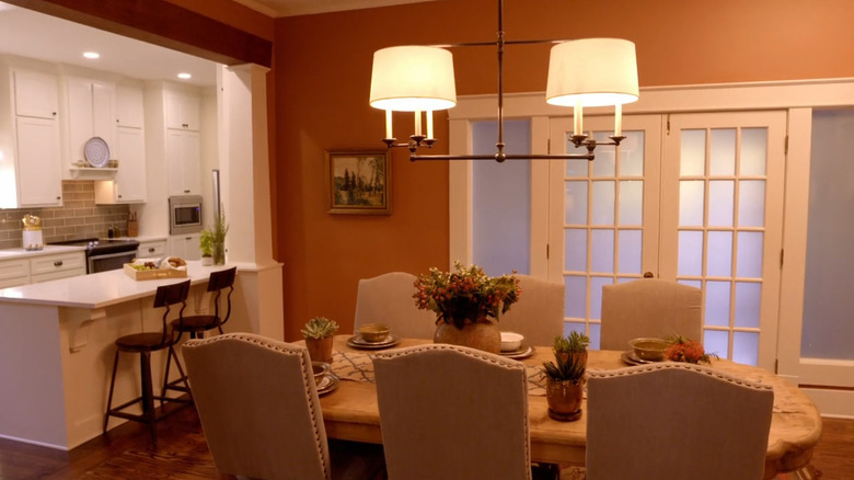 A warm-colored dining room designed by Erin Napier