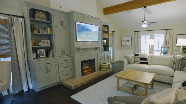 Television sideboard with fireplace and storage.