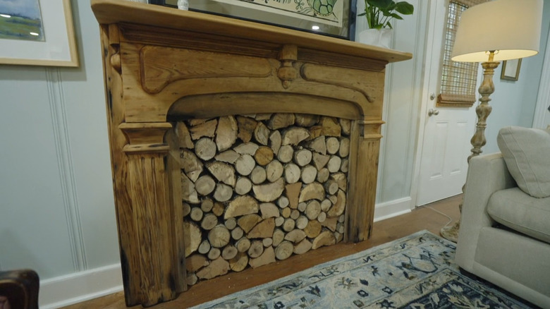 Faux fireplace with wood logs.