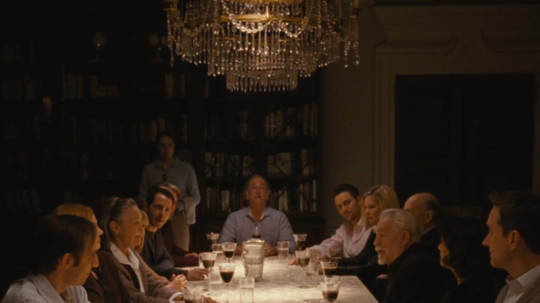 the Roy family under chandelier 