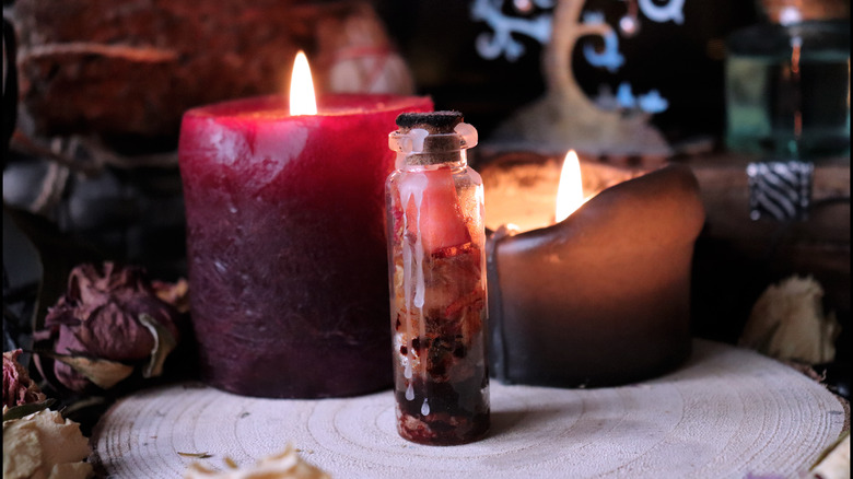 candles and a spooky potion jar