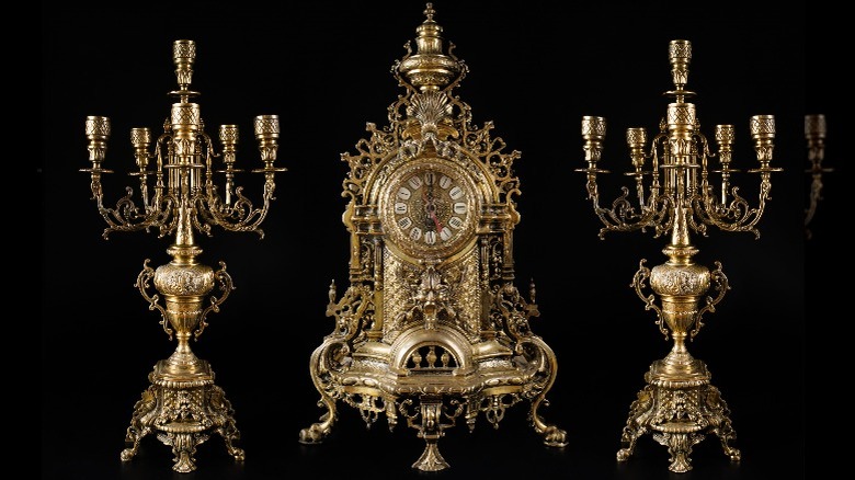 gold candelabras and antique clock