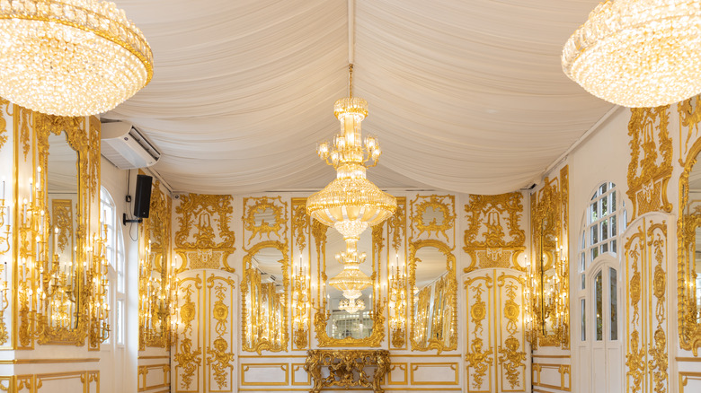 gold room with chandeliers 