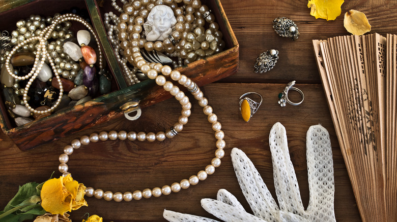 antique fan, gloves, and jewelry 