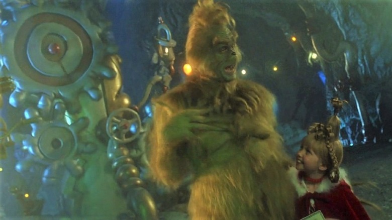 The Grinch talking to Cindy Loo in his cave