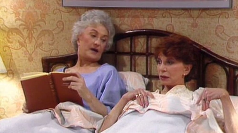 Golden girls reading in bed