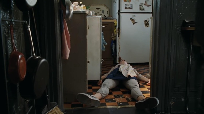 Julie laying on the kitchen floor