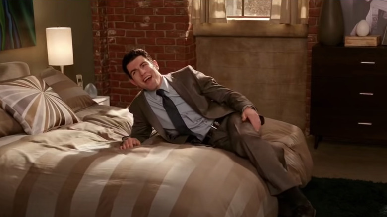 Schmidt lays on his bed 