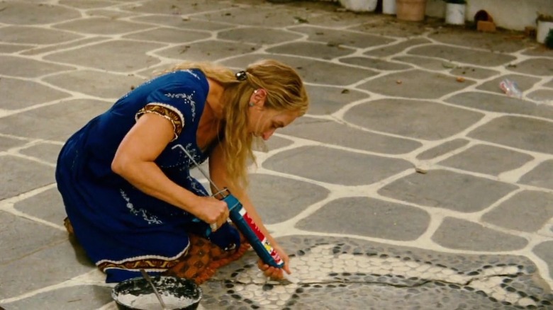 Donna repairs tile mosaics 