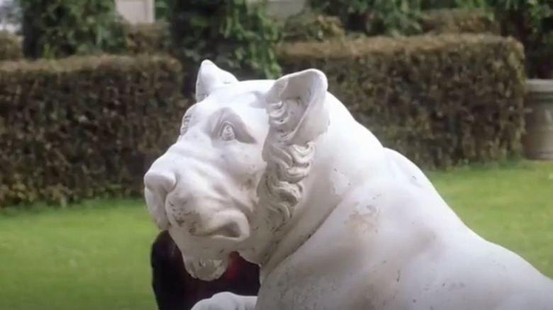 marble tiger sculpture in backyard 