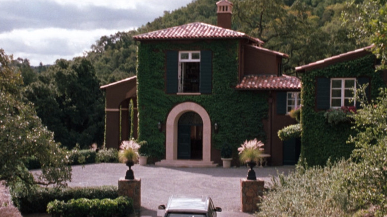 green vineyard house with arched door