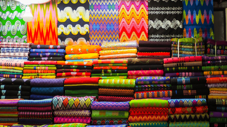 Brightly color blankets on display