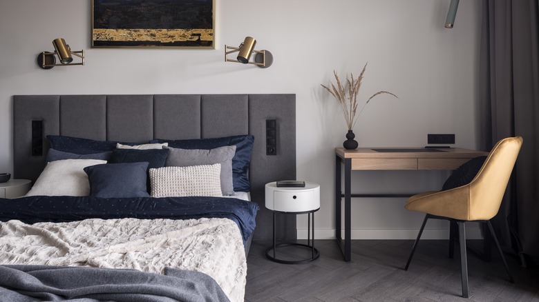 Bedroom with desk white blanket