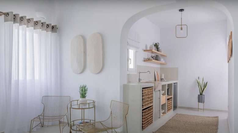 white living area with archway