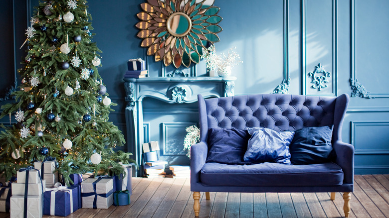 dark blue couch and Christmas tree