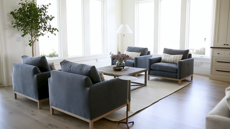 four blue chairs in sitting area