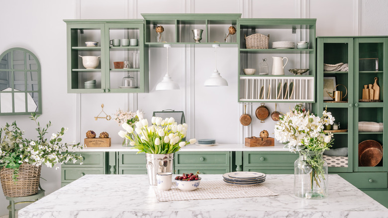 sage green kitchen with marble