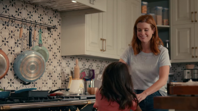 Maddie in kitchen with patterned tile