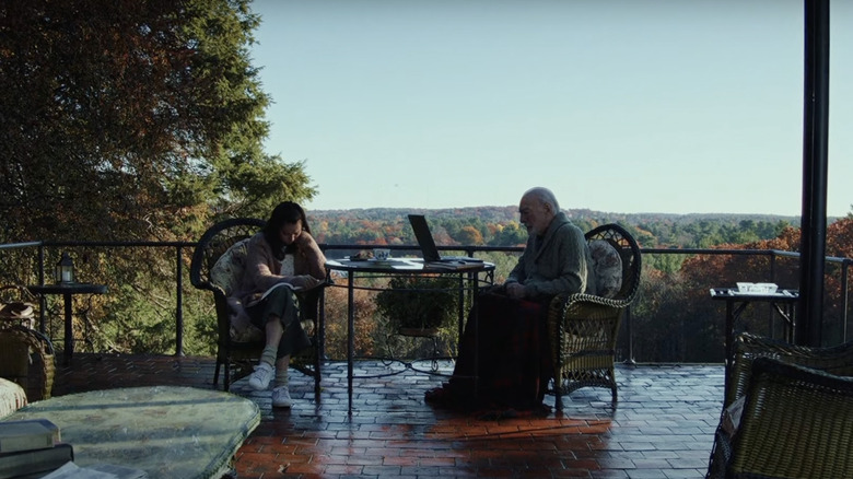 People sit on large patio in "Knives Out"