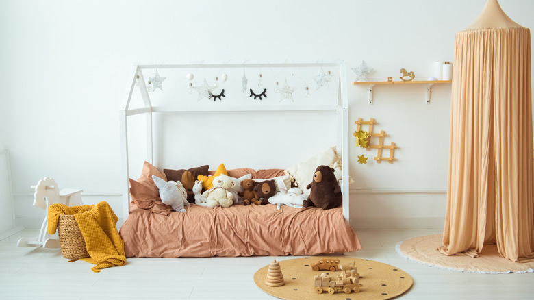 stuffed animals on child's bed