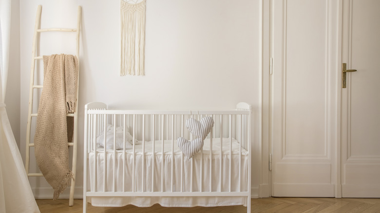 white crib in neutral nursery