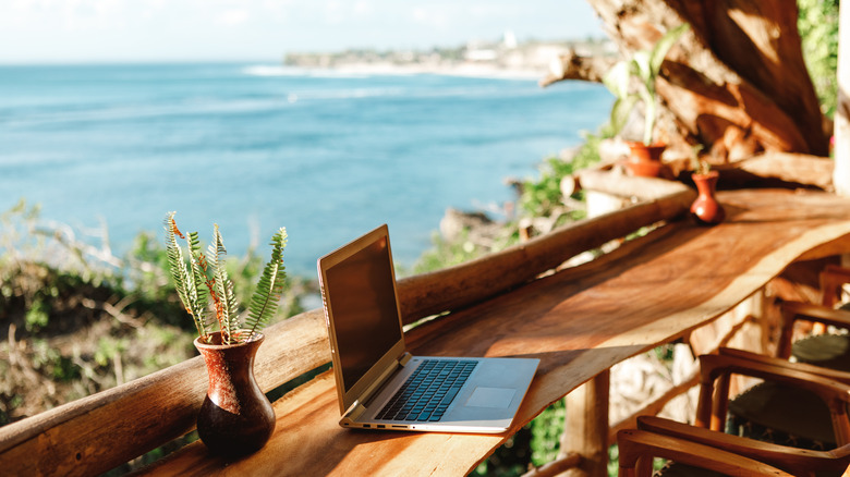 computer and bar overlooking ocean