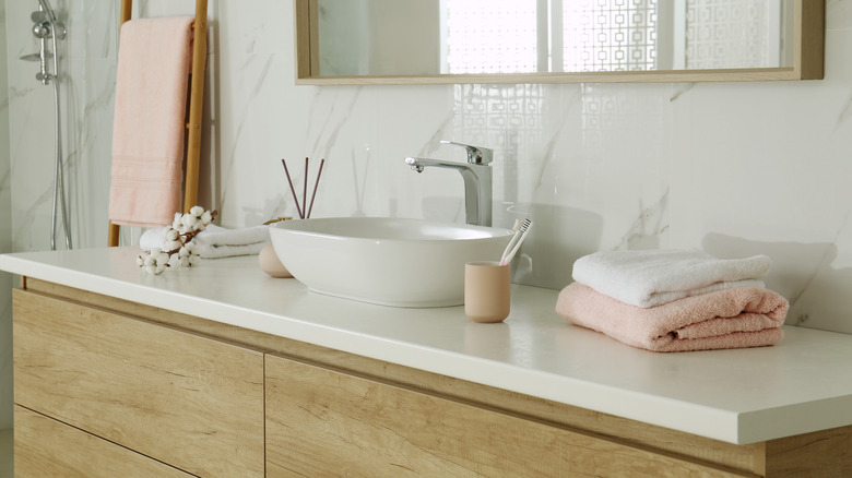 wooden vanity with bowl sink