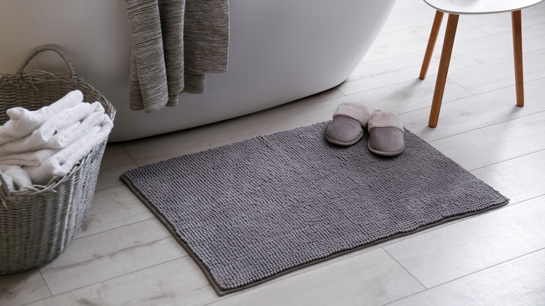 light gray floor and bathmat