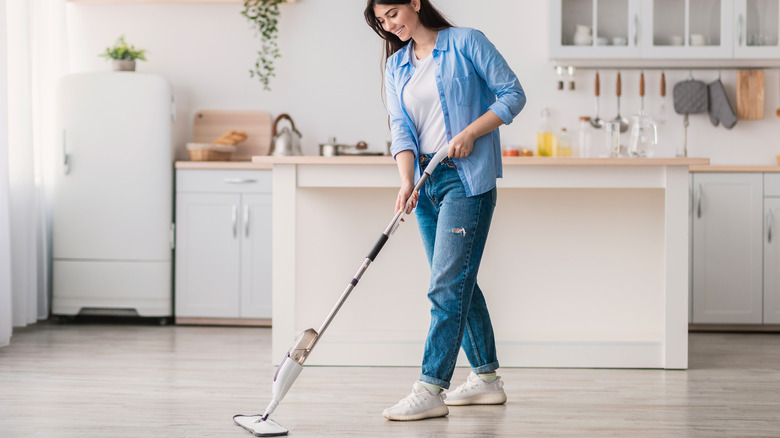 woman mopping kitchen floor