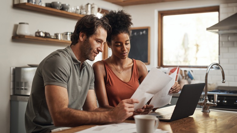 couple looking through papers