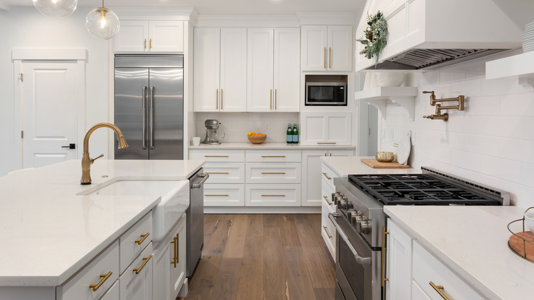 white kitchen with wooden floors