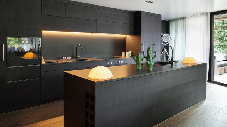 black kitchen with warm lighting