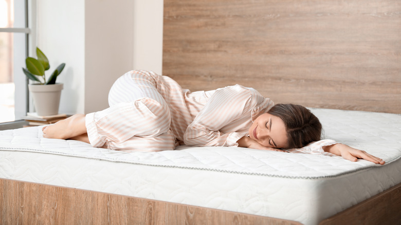 woman laying on mattress