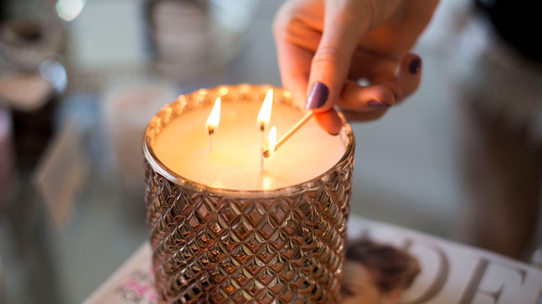 woman lighting candle