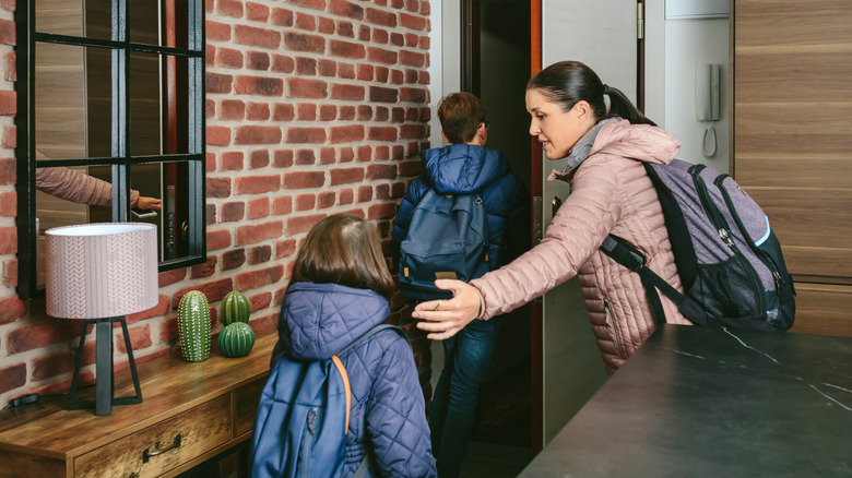 family leaving house