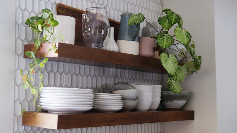 dishware on wooden floating shelves