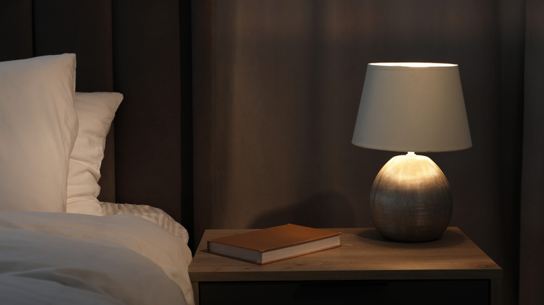 Lamp and book on a bedside table