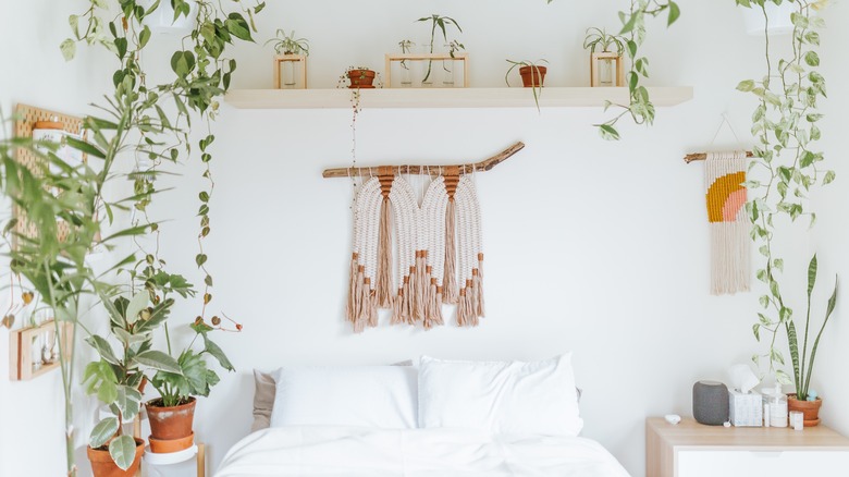 Shelf and wall art over bed