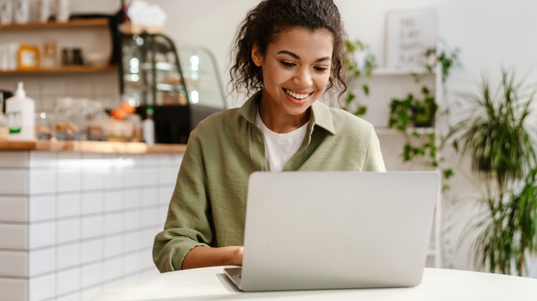 woman researching on laptop