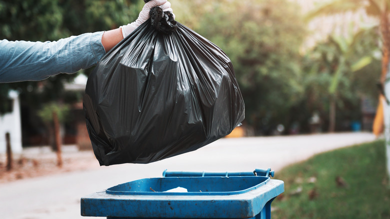 Throwing out household waste